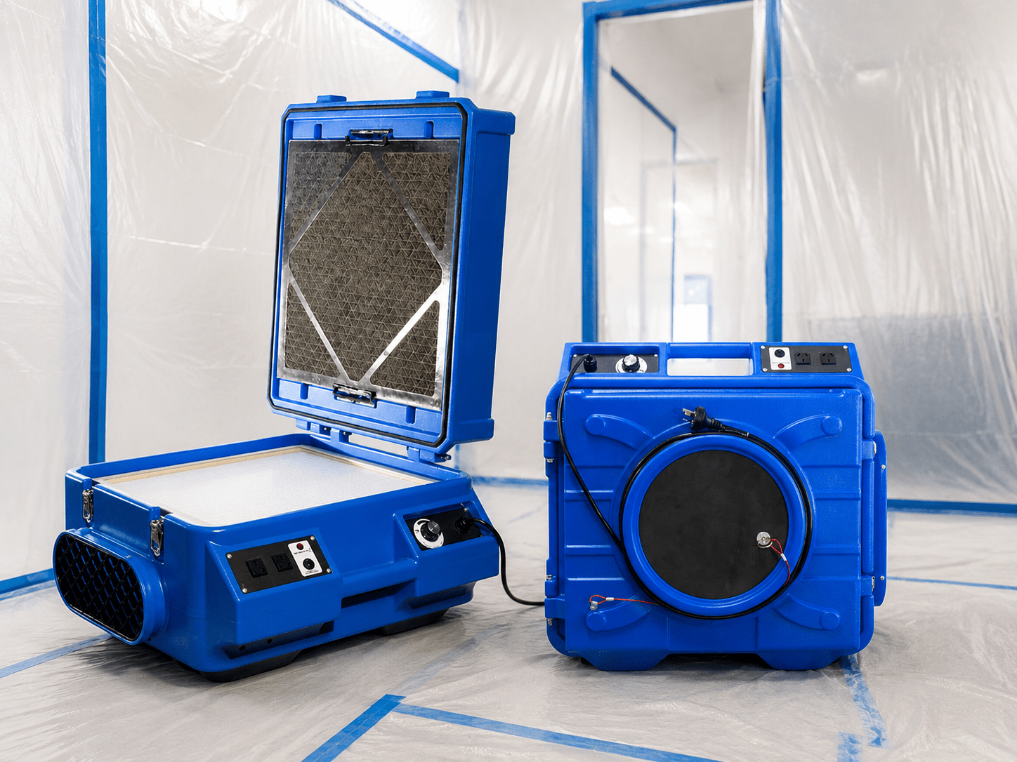 Professional HEPA air scrubbers used as part of a controlled mould remediation setup